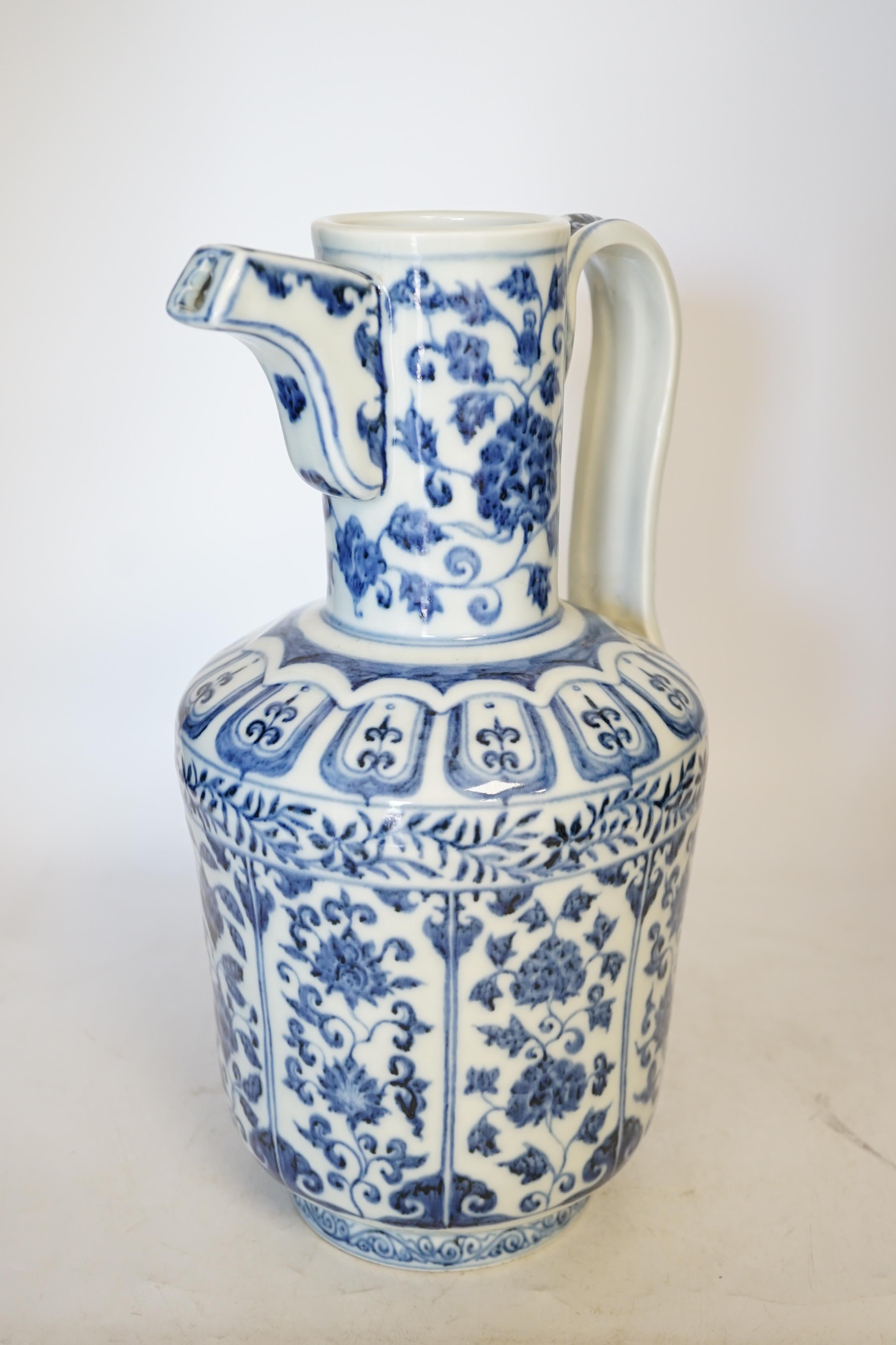 A Chinese blue and white monk’s cap ewer, 34cm high. Condition - good